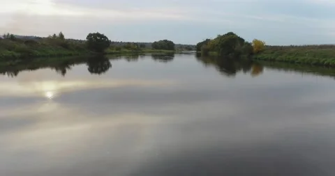 The drone was flying over the river before sunset Stock Footage 140521391
