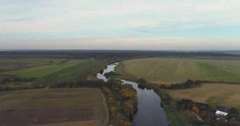 The drone was flying over the river before sunset Stock Footage 140601229