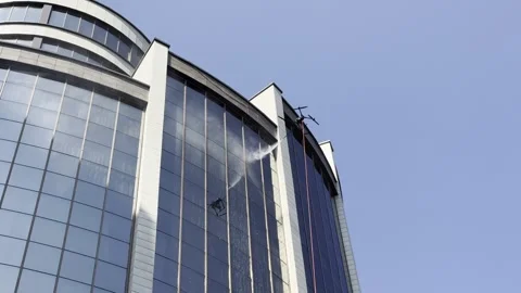 Drone is washing, cleaning windows of high building. Stock Footage 338171910
