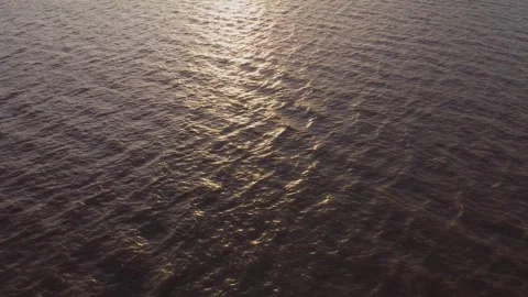 Drone, water surface, sunset, sun reflection, reflection. Hull.UK 5.8.2026 Stock Footage 346380547