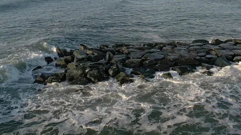 Drone waves crash rock jetty2  120FPS Stock Footage 151540903