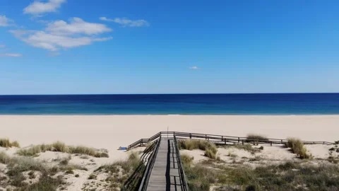 Drone white sandy beach with blue sky Video stock 235751775