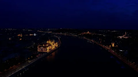 Drone wide view of Danube river and Budapest city skyline at night time Stock Footage 192408232