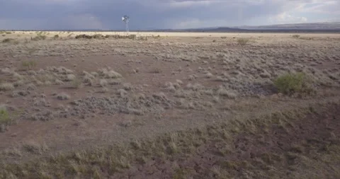 DRONE — Wide of Windmill and Desert, Texas Stock Footage 256818311