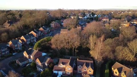 Drone - Winter - UK Low to High Manchester distance reveal Stock Footage 325976176
