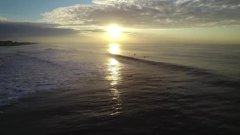 Drone zoom in on ocean waves at sunset in Los Cristianos Tenerife 스톡 동영상 329461901
