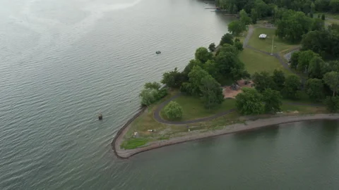 Drone zoom out from long point on cayuga lake Stock Footage 140759703