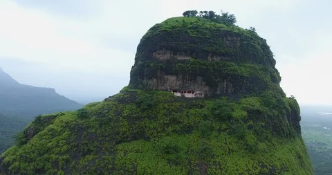 Drone zoom out shot from inside the mountain cave to reveal the entire mountain Stock Footage 117094591