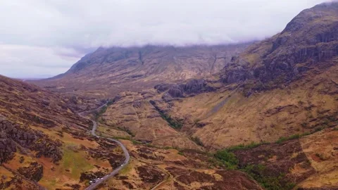 Drone Zoom In Over Glencoe Valley Scotland With Mountain Road Видео 332683335