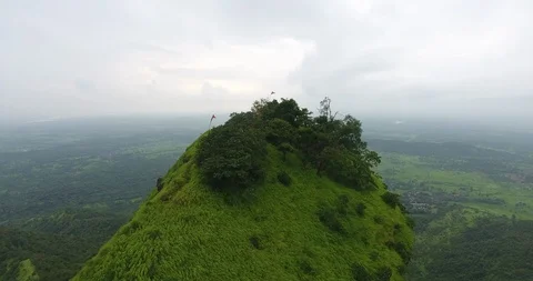 Drone zoom in shoot over the peak to reveal the temple on top of the mountain. Stock Footage 117082583