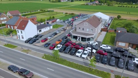 Drone Zoom In Toward Vehicle Compound With Parked Automobiles Stock Footage 340535148