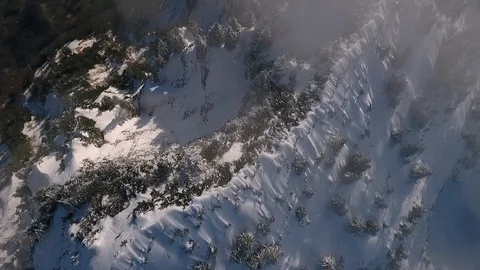 Droneflight over a mountain peak Video stock 100600486