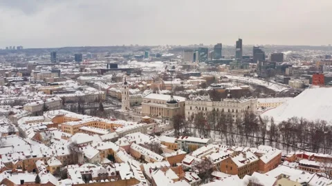 A drone’s aerial view of downtown Vilnius on a snowy winter day. Stock Footage 325619965