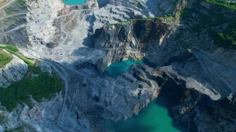 Drones are flying over beautiful quarry. stone industry Stock Footage 210786046
