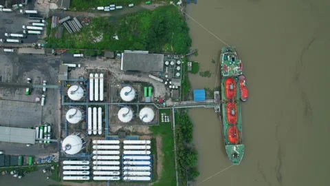 Drones are flying over a gas tanker docked in port Stock Footage 210773732