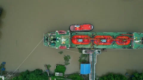 Drones are flying over a gas tanker docked in port Stock Footage 210777702