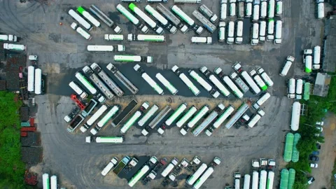 Drones are flying over a many gas trucks at the gas plant Stock Footage 210775506