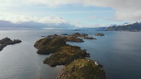 Drone's Ascent: Starting the Aerial Exploration from the Pinnacle of a Norwegian Stock Footage 254924329