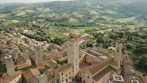 The drone's camera moves backwards.San Gimignano aerial view, historic medieval Video stock 306292389