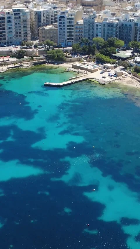 Drones Capture Clear Blue Water and Boats at Seaside Location on a Sunny Day in Stock Footage 333919402