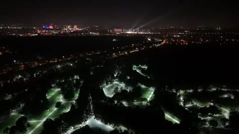 A Drone's Expansive Night Vision Over a Radiant Park Vídeos de archivo 313435884
