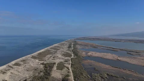 A Drone's Expansive Traversal Above a Slender Barrier Stock Footage 314071526