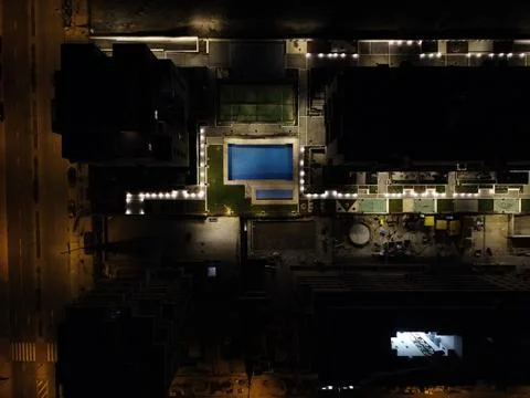 Drone's eye on quiet streets in Madrid illuminated by Lampposts Stock Photos