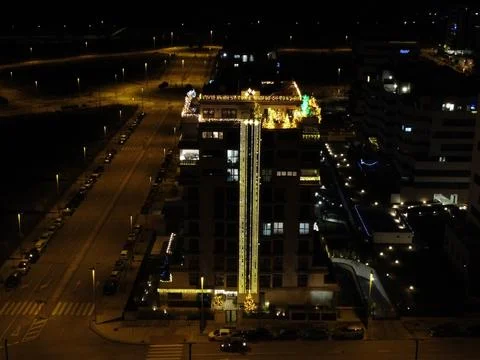 Drone's eye on quiet streets in Madrid illuminated by Lampposts Stock Photos