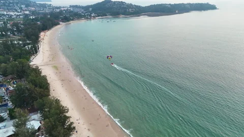 Drone's eye view of paragliding over a Thai beach Stock Footage 310386296