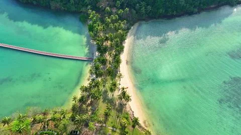 Drone's eye view: Sandy shores, azure sea, heaven's touch.  Photos