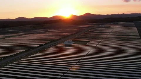 A Drone's Eye View of a Solar Farm at Sunset Stock Footage 233653757