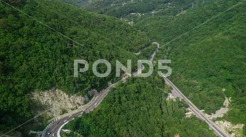 Drones Eye View - winding road from the high mountain pass in Sochi, Russia Stock Photos