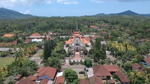 Drones fly away from Sacred Heart of Jesus Catholic Church West Bali Indonesia 库存影片 129673673
