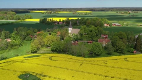 Drones fly over a Swedish village in the country on a beautiful summer day Stock Footage 161108839