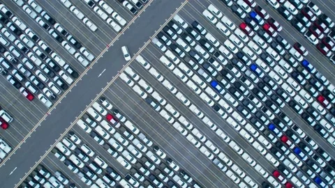Drones flying over of many vehicles at parking lots Stock Footage 210771424