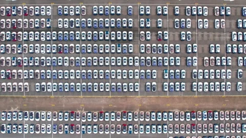 Drones flying over of many vehicles at parking lots Stock Footage 210794111