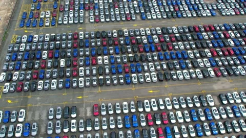 Drones flying over of many vehicles at parking lots Stock Footage 210795188