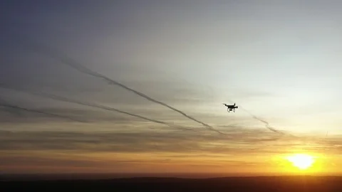 Drones flying at sunset Stock Footage 123726875