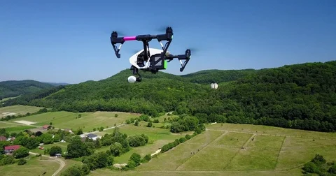 Drones flying together drone filming quadrocopter in flight Stock Footage