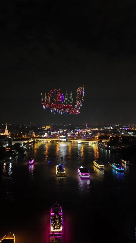 Drones Forming a Royal Barge Over Bangkok, Thailand's Chao Phraya River at Night Stock Footage 335970102