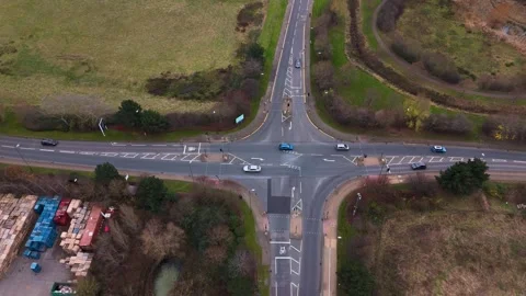 Drone's Graceful Traverse Above a Buzzing Junction Toward a Residential estat Stock Footage 269852486