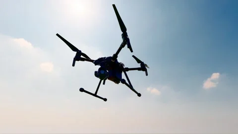 Drones hover in the sky for patrol and reconnaissance Stock Footage 300230733