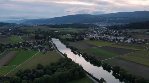 Drones hyperlapse towards the city of Biel and the river Aare at dusk Stock Footage 140424600