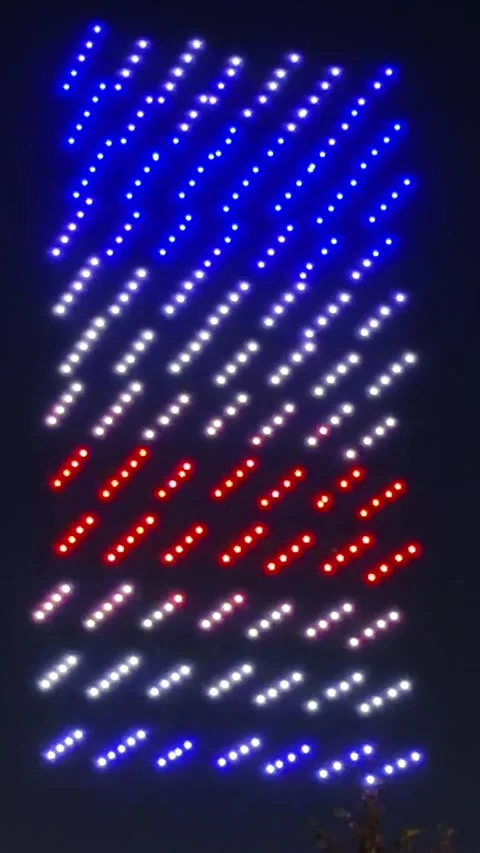 Drones light up the night sky in rows of red white and blue Video stock 339215470