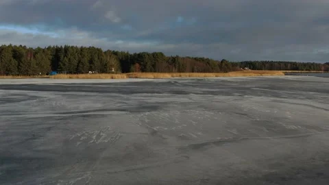 Drones at low altitude panning a Swedish beach in the winter Stock Footage 169270137