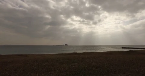 Drones passing through a girl taking pictures. Sunshine clouds sea drone Aerial 動画素材 72956542