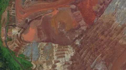 Drone's perspective flying over an open cast bauxite mine. The vast industrial Stock Footage 331632671