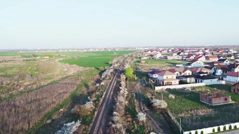 A drone's perspective of railways besides a village Video stock 272993651