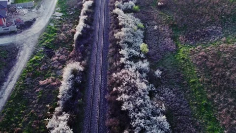 A drone's perspective of railways next to a village Video stock 272993505