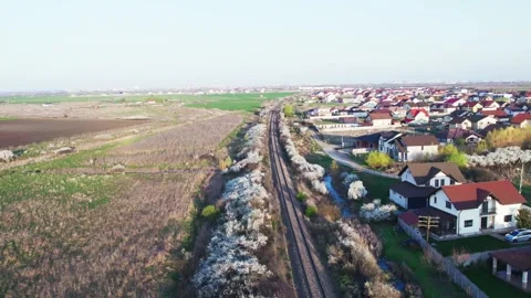 A drone's perspective of railways next to a village Video stock 272993820